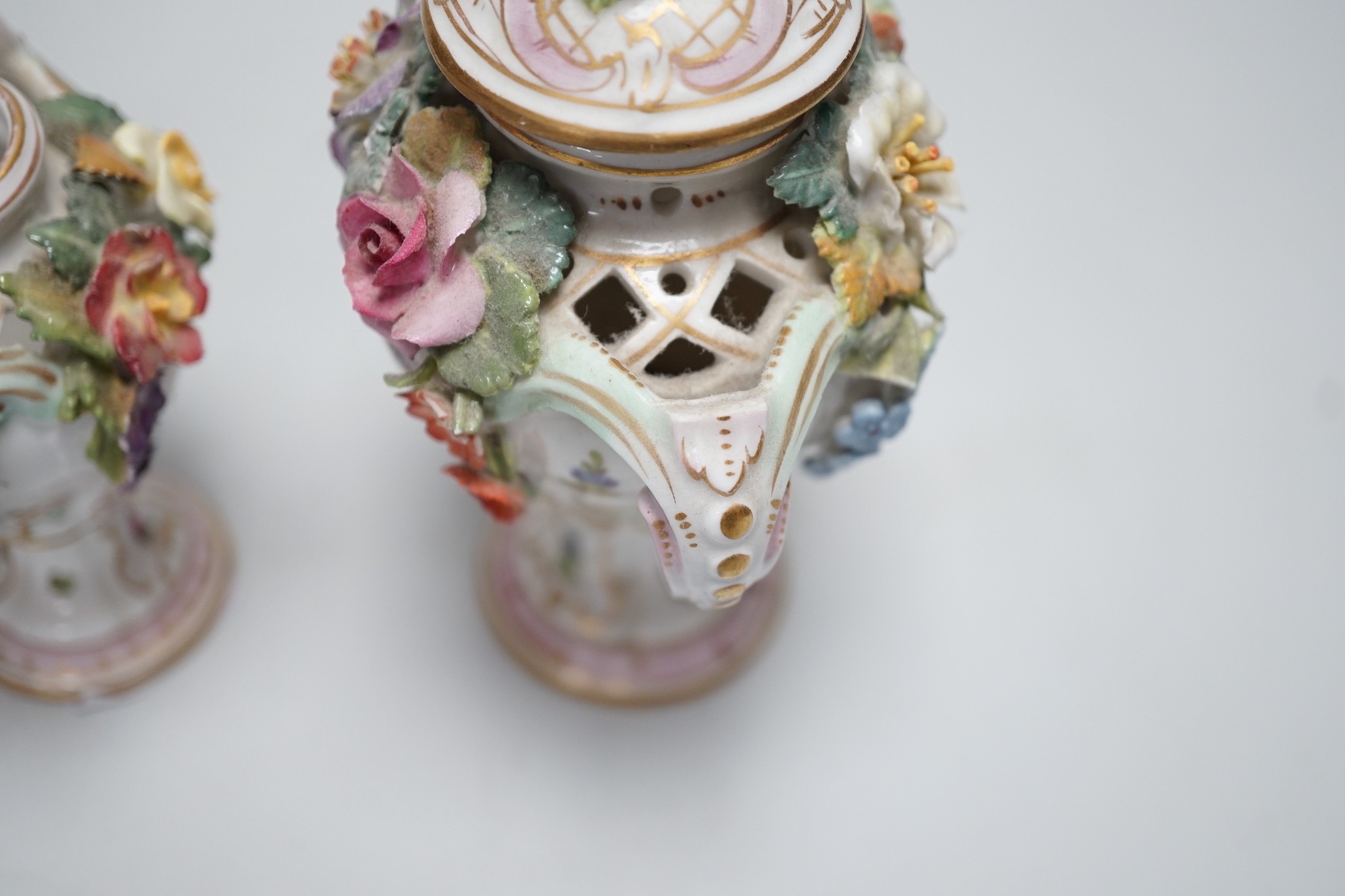 Three 19th century Dresden floral encrusted vases, two with covers, 16cm